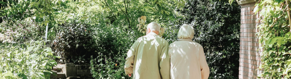 Older Couple Walking Down Path